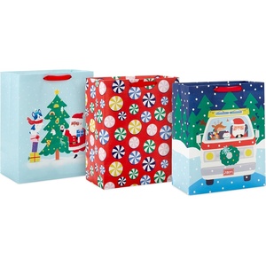Hallmark 13″ Large Christmas Gift Bags for Kids (3 Bags: Santa and Puppy, Santa in RV, Colorful Candy)(Santa and Puppy  Santa in RV  Peppermints)